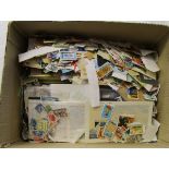 Stamps - Large number of world stamps for sorting - Mostly on paper
