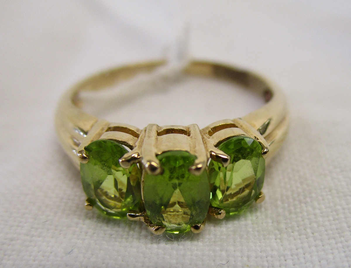 Gold 3 stone peridot ring