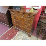 Early walnut chest of 3 over 3 drawers on bracket feet with herring-bone cross banding