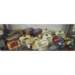 Shelf of diecast busses etc. many boxed