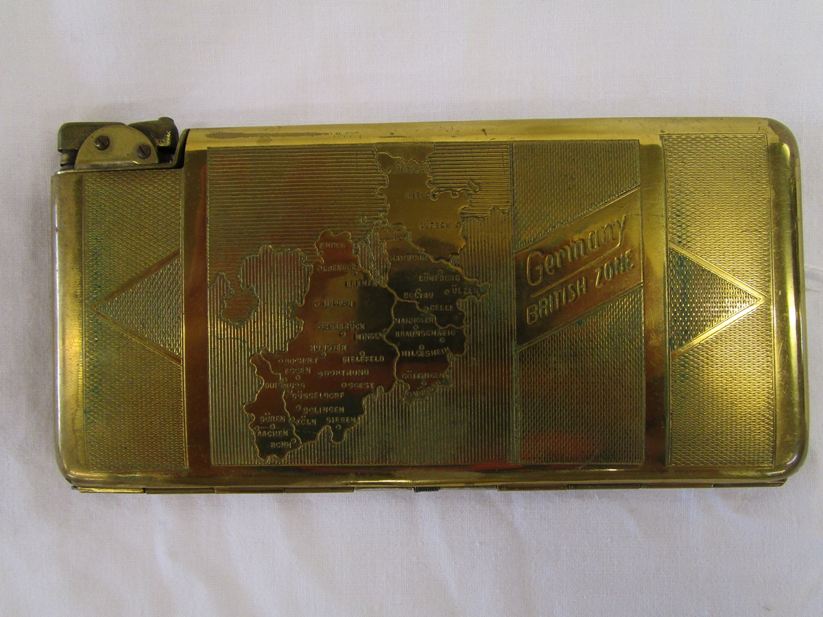 Brass cigarette case-lighter (approx 8.5cm x 17cm) bearing engraved markings 'Germany BRITISH