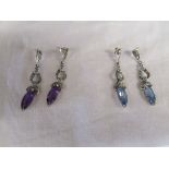 2 pairs of silver earrings