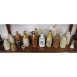 Shelf of early stoneware bottles
