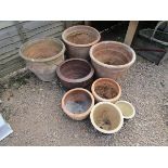 4 large stone planters and 4 small