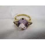Gold faceted amethyst & diamond set ring
