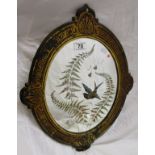 Ornate mirror with butterfly wing decoration