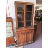 Oak glazed bookcase on cupboard (glass missing)