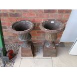 2 large cast iron pedestal urns
