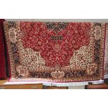 Red ground Keshan carpet (approx 2.8m x 2m)