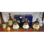 Box of Wade Bells decanters to include 1 full