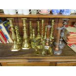 Collection of brass candlesticks to include copper