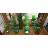 Collection of 8 green glass stem vases