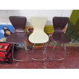 3 chrome and leather swivel bar stools