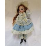 Small porcelain headed doll