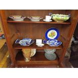 Collection of china across three shelves to include unusual fish dishes