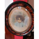 Picture of boy in ornate frame