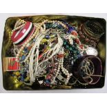 Tin of costume jewellery