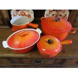 4 pieces of orange Le Creuset