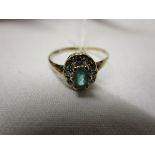 Gold emerald & diamond cluster ring