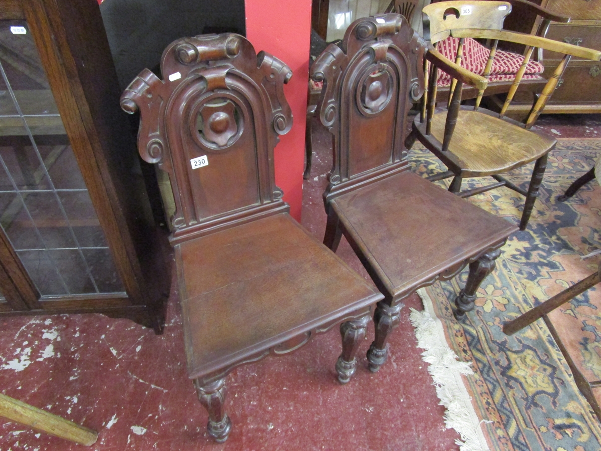 Pair of early mahogany hall chairs