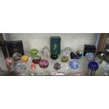 Shelf of paper weights to include Caithness