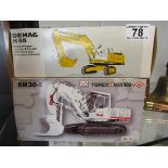 2 boxed diecast diggers