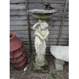 Stone statue bird bath