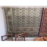 Green ground Bokhara carpet (2.3 x 1.6 metres)