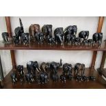 Quantity of ebony elephants over 2 shelves