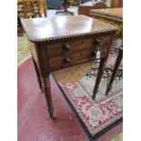 William IV mahogany sewing table featuring two drawers and sliding sewing bag. On four ring turned