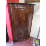 Antique bow-front mahogany corner cupboard