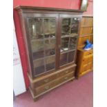 Victorian oak glazed bookcase over 2 drawers