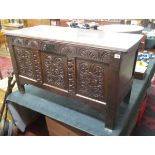 Early carved oak coffer with candle box