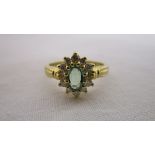 18 carat emerald and diamond cluster ring