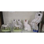 Collection of Staffordshire dogs and zebras
