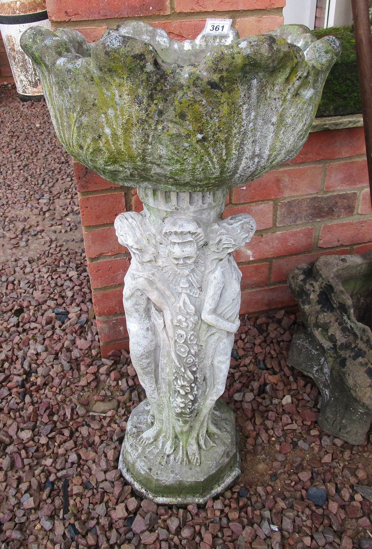 Stone planter on plinth