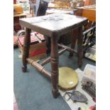 Early elm seated stool with turned legs