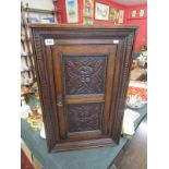 Small carved oak corner cupboard