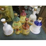 Collection of Wade bells decanters to include 1 full