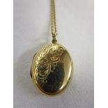 Gold locket on chain