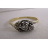 Gold 3 stone diamond twist ring