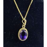 Gold amethyst pendant on chain