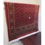 Red ground Bokhara rug - Approx 1.9m x 1.4m