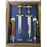 Cased 1939 SS dagger, 1933 SA dagger both with sheaths & NSDAP badge