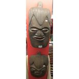 2 carved African wall masks