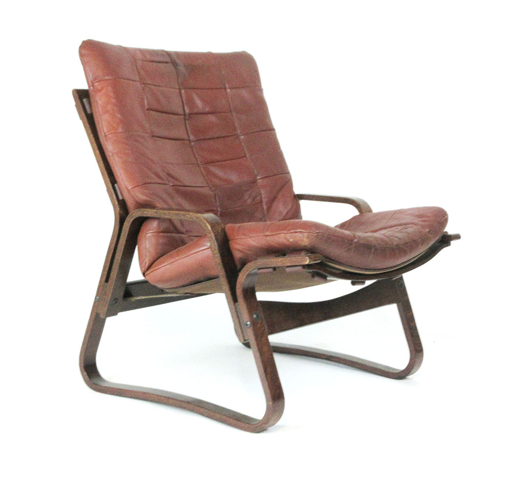 A 1970's bentwood armchair with a loose brown leather cushion CONDITION REPORT: