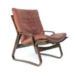 A 1970's bentwood armchair with a loose brown leather cushion CONDITION REPORT: