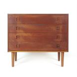 A 1970's teak chest of four long drawers on circular feet, w.