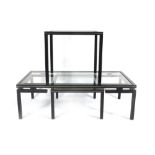 A French coffee table with a rectangular glass surface over a smaller nesting table by Pieere