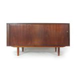 A 1970's teak tambour fronted sideboard on tapering legs, l.